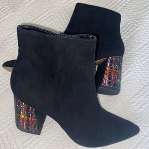 Black booties with bejeweled heel